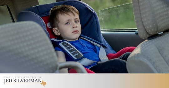 Toddler in the backseat of a car